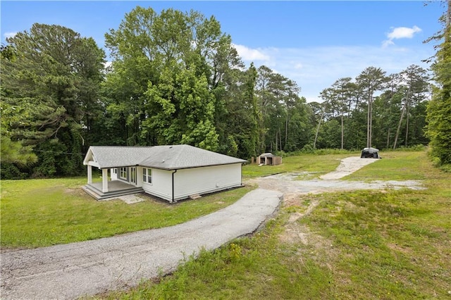 2552 Scenic Hwy S, Snellville, GA 30078 - view of property exterior featuring a yard and asphalt driveway