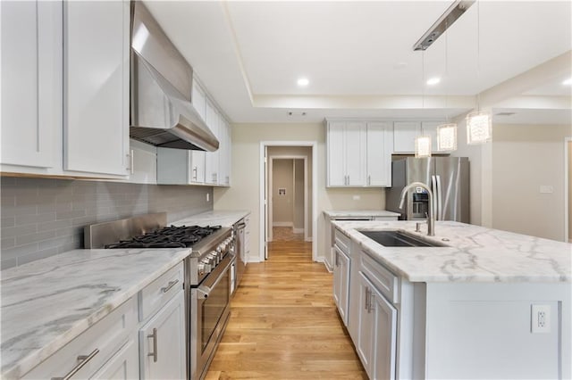2552 Scenic Hwy S, Snellville, GA 30078 - kitchen with appliances with stainless steel finishes, a sink, an island with sink, light wood-style floors, and recessed lighting