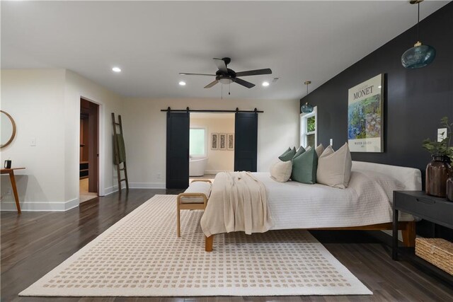 1218 Crestwood Dr SE, Atlanta, GA 30316 - bedroom with a barn door, dark wood-style flooring, recessed lighting, and a ceiling fan