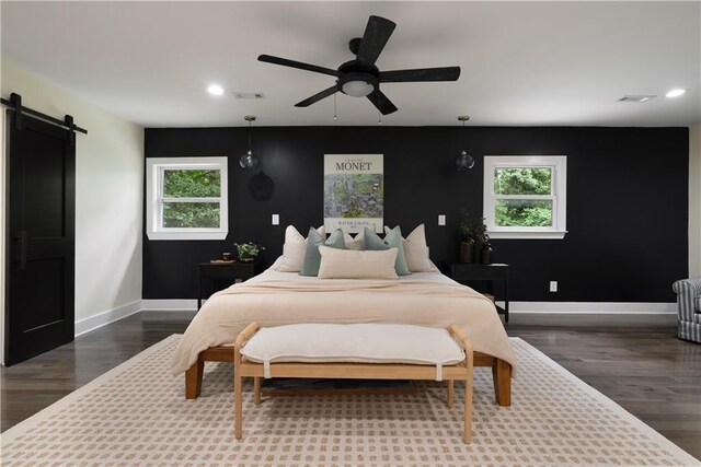 1218 Crestwood Dr SE, Atlanta, GA 30316 - bedroom featuring a barn door, multiple windows, recessed lighting, and dark wood-type flooring