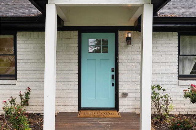 1218 Crestwood Dr SE, Atlanta, GA 30316 - property entrance featuring brick siding, a shingled roof, and covered porch