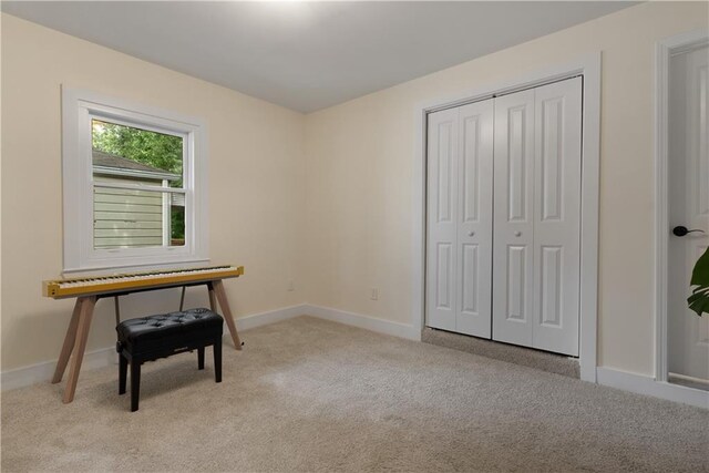 1218 Crestwood Dr SE, Atlanta, GA 30316 - bedroom featuring light carpet and a closet
