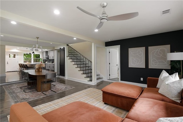 1218 Crestwood Dr SE, Atlanta, GA 30316 - living room with a barn door, stairway, a ceiling fan, dark wood-style floors, and recessed lighting