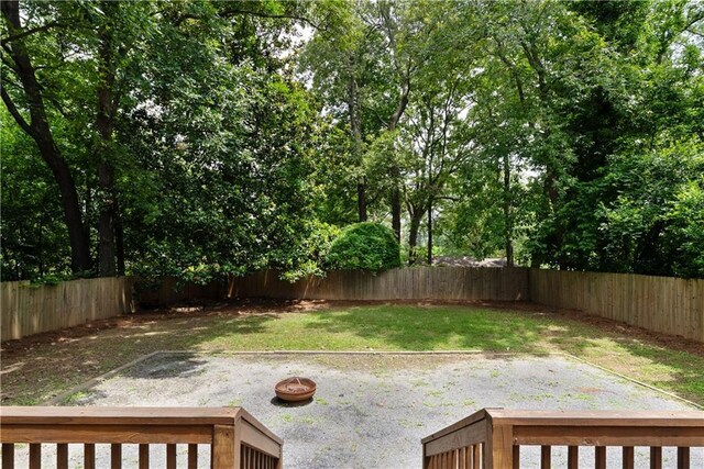 1218 Crestwood Dr SE, Atlanta, GA 30316 - back of house with a fenced backyard and a wooden deck