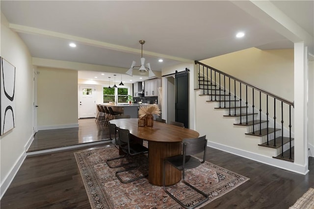 1218 Crestwood Dr SE, Atlanta, GA 30316 - dining area with a barn door, dark wood-style flooring, recessed lighting, and stairs