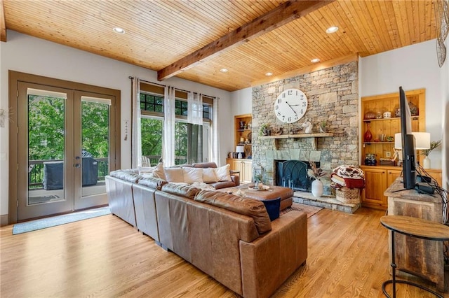 99 Bree Ln, Canton, GA 30114 - living area with beam ceiling, a fireplace, wooden ceiling, french doors, and light wood-style flooring