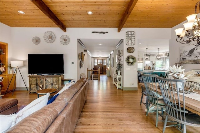 99 Bree Ln, Canton, GA 30114 - living area with light wood-type flooring, baseboards, a chandelier, and beamed ceiling