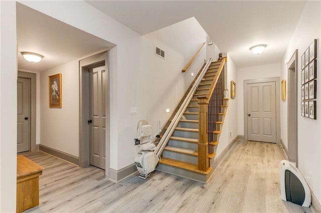 99 Bree Ln, Canton, GA 30114 - staircase featuring baseboards, wood finished floors, and visible vents