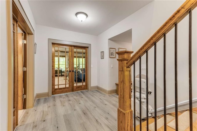 99 Bree Ln, Canton, GA 30114 - entryway featuring baseboards, french doors, and light wood-type flooring