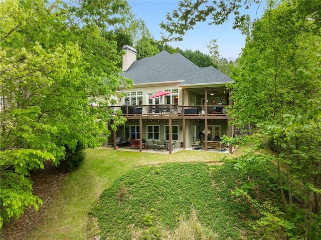 99 Bree Ln, Canton, GA 30114 - rear view of house with a lawn, a patio, a chimney, and a deck