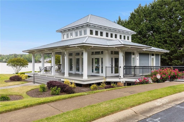 99 Bree Ln, Canton, GA 30114 - view of front of home with a porch, french doors, and metal roof