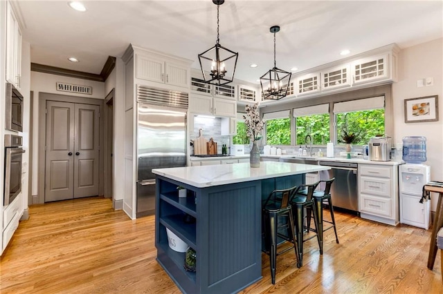 99 Bree Ln, Canton, GA 30114 - kitchen with an inviting chandelier, open shelves, recessed lighting, white cabinetry, and stainless steel appliances
