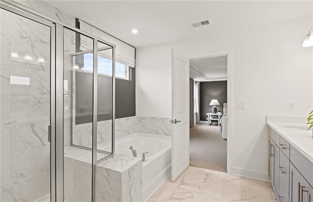 bathroom featuring vanity and plus walk in shower