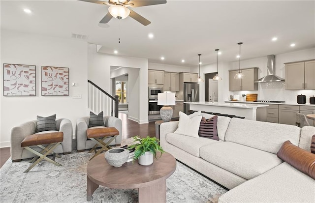 living room with dark wood-type flooring and ceiling fan