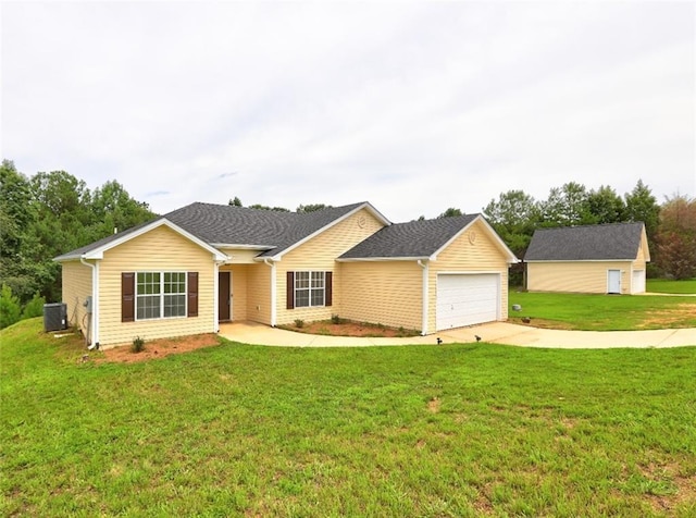 ranch-style home with a front yard, a garage, and central air condition unit