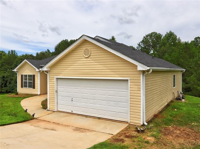 garage featuring a yard