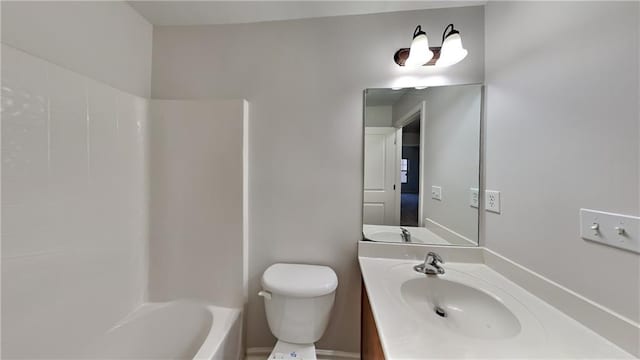 bathroom featuring tub / shower combination, toilet, and vanity