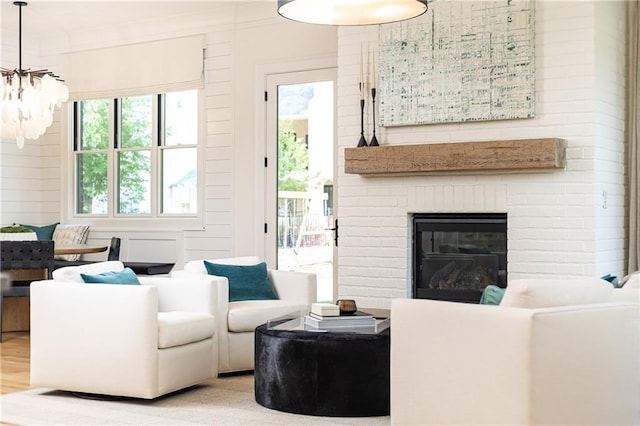 3338 Breton Cir NE, Brookhaven, GA 30319 - living area with a chandelier, a fireplace, and wood finished floors