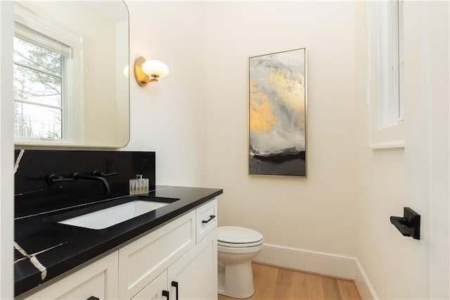 3338 Breton Cir NE, Brookhaven, GA 30319 - bathroom featuring vanity, wood finished floors, toilet, and baseboards