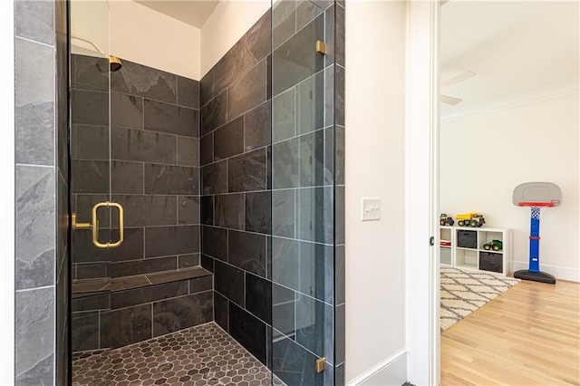 3338 Breton Cir NE, Brookhaven, GA 30319 - bathroom featuring a stall shower, wood finished floors, baseboards, and ornamental molding