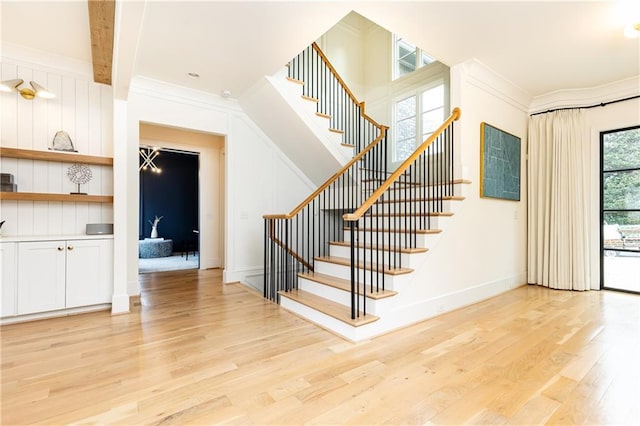 3338 Breton Cir NE, Brookhaven, GA 30319 - stairs featuring wood finished floors, ornamental molding, and baseboards