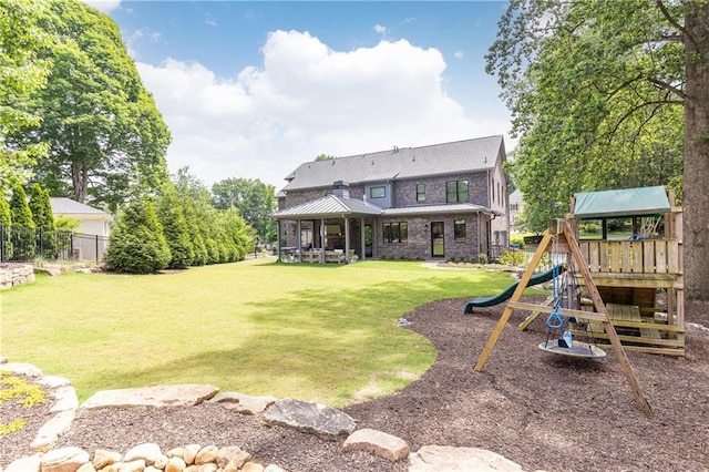 3338 Breton Cir NE, Brookhaven, GA 30319 - back of property featuring a playground, a standing seam roof, and metal roof