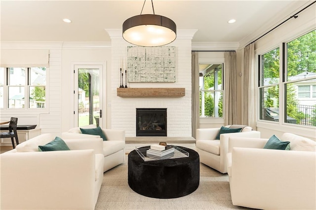 3338 Breton Cir NE, Brookhaven, GA 30319 - living room with plenty of natural light, crown molding, a fireplace, and recessed lighting