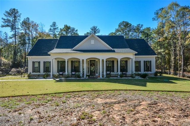 view of front of home with a front lawn and a porch