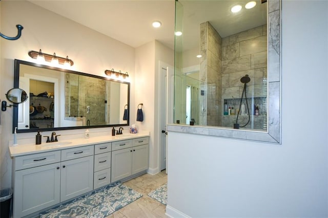 bathroom with vanity and a shower with shower door