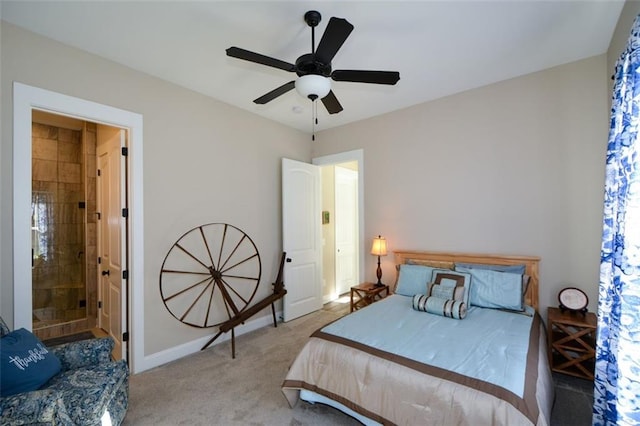 carpeted bedroom with ceiling fan and ensuite bathroom