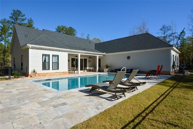 back of house featuring a lawn, a patio area, and ceiling fan