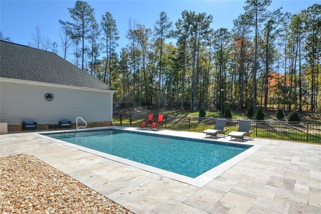 view of swimming pool with a patio area