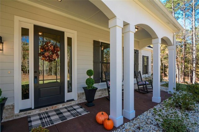 doorway to property with a porch