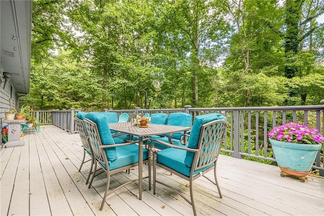 5848 Kingswood Ct, Norcross, GA 30093 - wooden terrace featuring outdoor dining space and view of wooded area