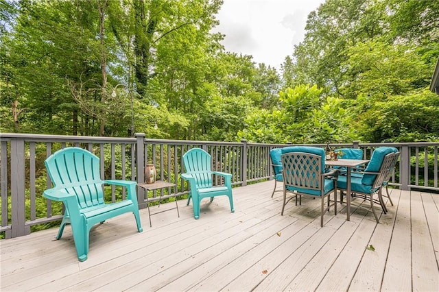 5848 Kingswood Ct, Norcross, GA 30093 - wooden deck featuring outdoor dining area and view of scattered trees