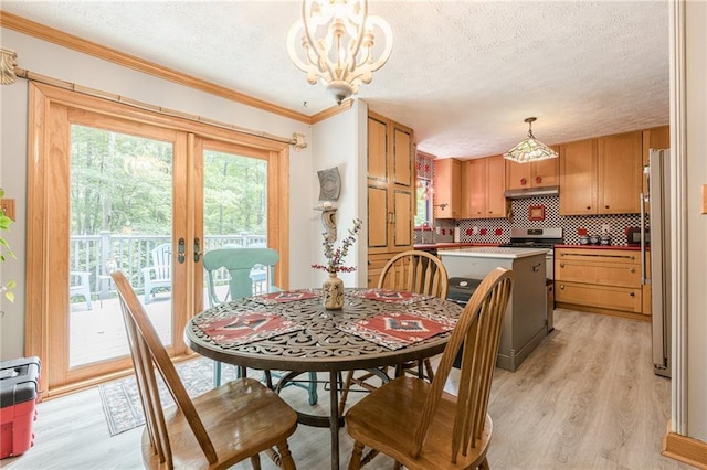5848 Kingswood Ct, Norcross, GA 30093 - dining room featuring a textured ceiling, light wood finished floors, ornamental molding, a chandelier, and french doors