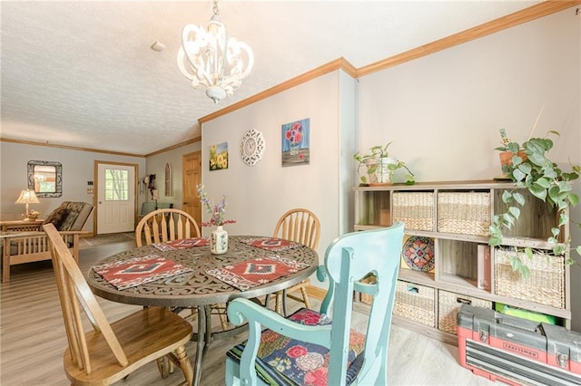 5848 Kingswood Ct, Norcross, GA 30093 - dining space with ornamental molding, a chandelier, and wood finished floors