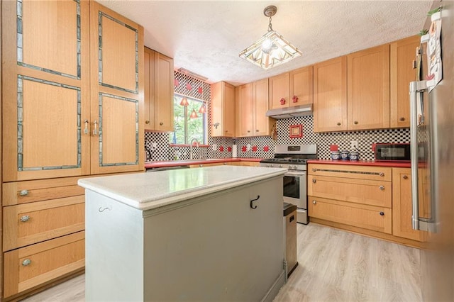 5848 Kingswood Ct, Norcross, GA 30093 - kitchen featuring appliances with stainless steel finishes, under cabinet range hood, light wood-type flooring, a textured ceiling, and a center island