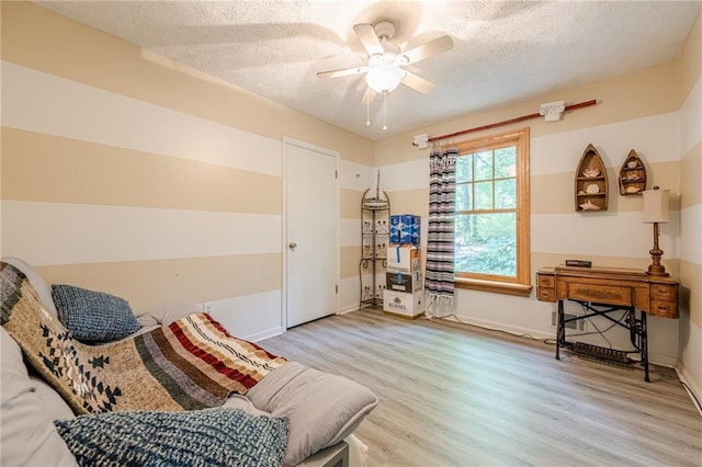 5848 Kingswood Ct, Norcross, GA 30093 - living area with a textured ceiling, light wood-style floors, and ceiling fan