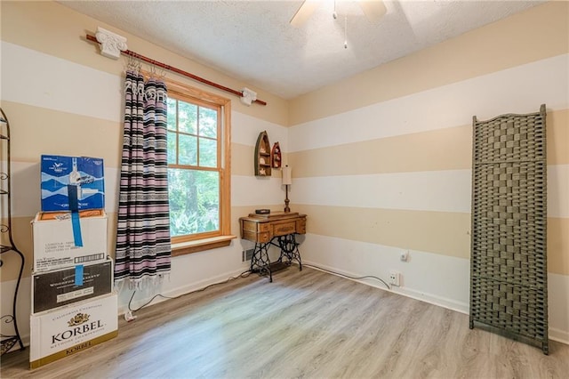 5848 Kingswood Ct, Norcross, GA 30093 - unfurnished room featuring wood finished floors, a ceiling fan, and a textured ceiling