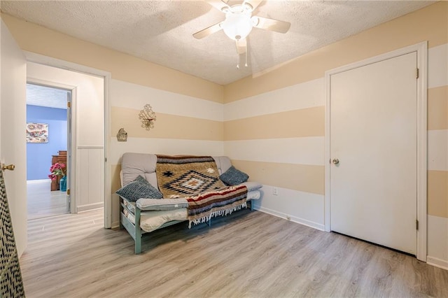 5848 Kingswood Ct, Norcross, GA 30093 - living area featuring light wood-type flooring, a textured ceiling, and ceiling fan