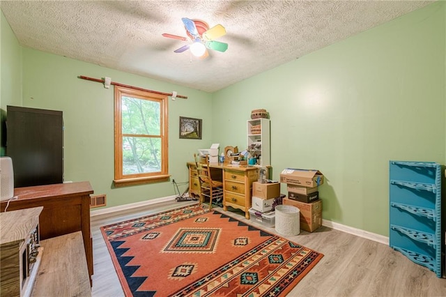 5848 Kingswood Ct, Norcross, GA 30093 - office area featuring wood finished floors, a ceiling fan, and a textured ceiling