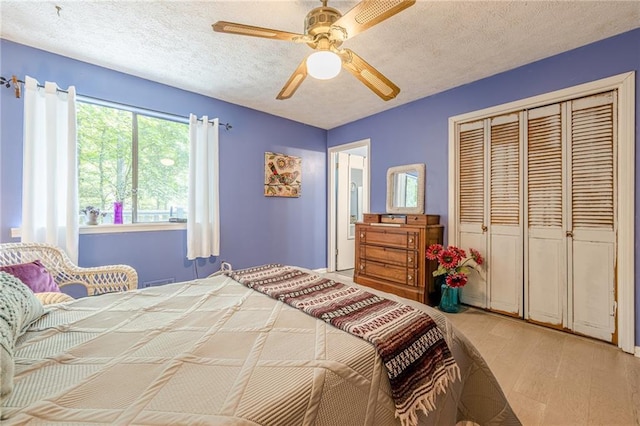 5848 Kingswood Ct, Norcross, GA 30093 - bedroom with a closet, a ceiling fan, and a textured ceiling