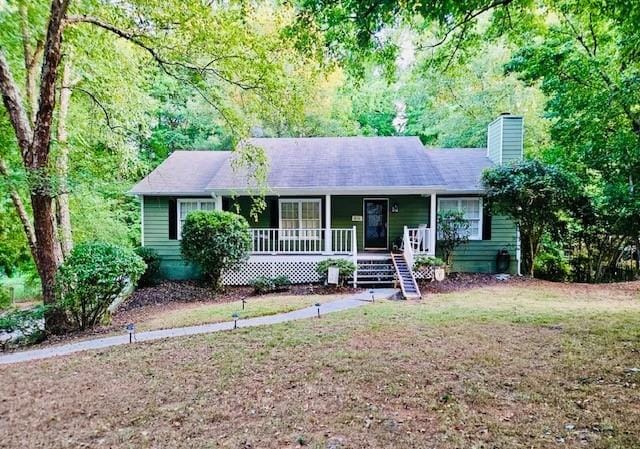 single story home featuring covered porch