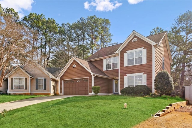 traditional home with driveway, a front lawn, a garage, and fence