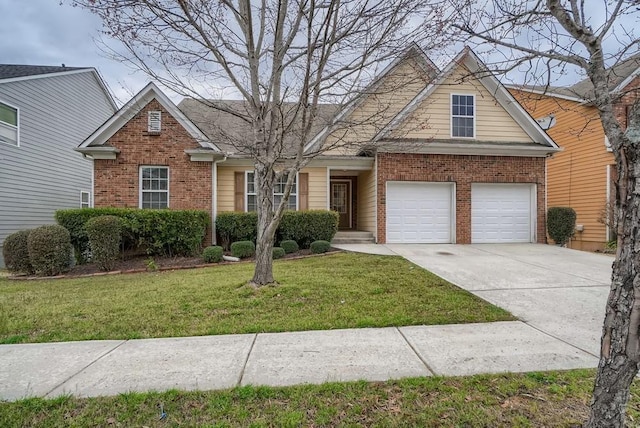 view of front of property with a front yard and a garage