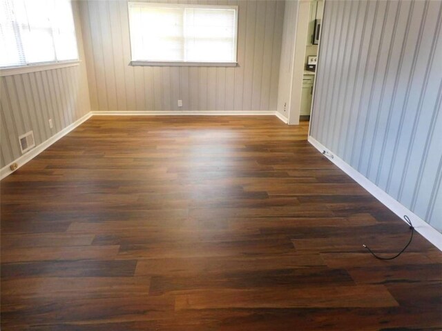 893 Andrews Dr, Conyers, GA 30012 - empty room featuring dark wood-style floors and baseboards