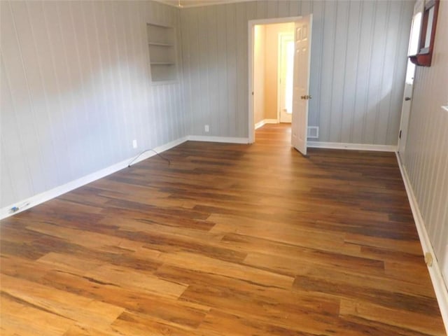 893 Andrews Dr, Conyers, GA 30012 - empty room featuring wood finished floors and baseboards