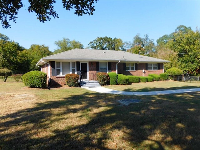 893 Andrews Dr, Conyers, GA 30012 - ranch-style house featuring a front yard and brick siding