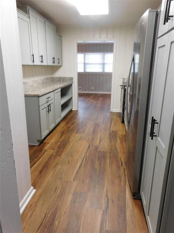 893 Andrews Dr, Conyers, GA 30012 - kitchen featuring gray cabinetry, freestanding refrigerator, dark wood finished floors, light countertops, and baseboards